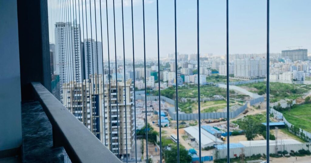 Invisible grill installed on apartment balcony in Hyderabad