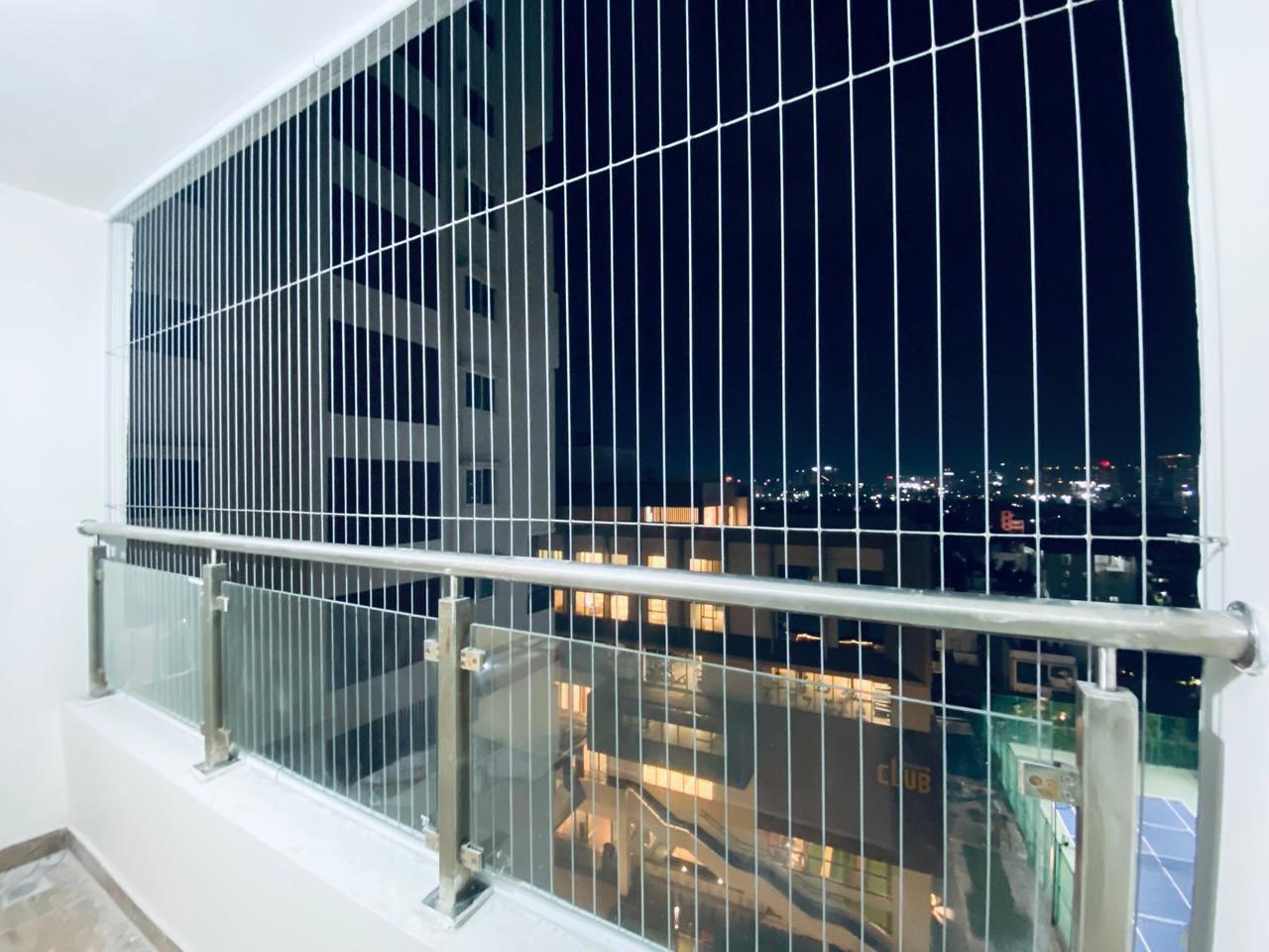 Invisible grills installed Hyderabad Hitech City premium apartment balcony view preserved Grade 316