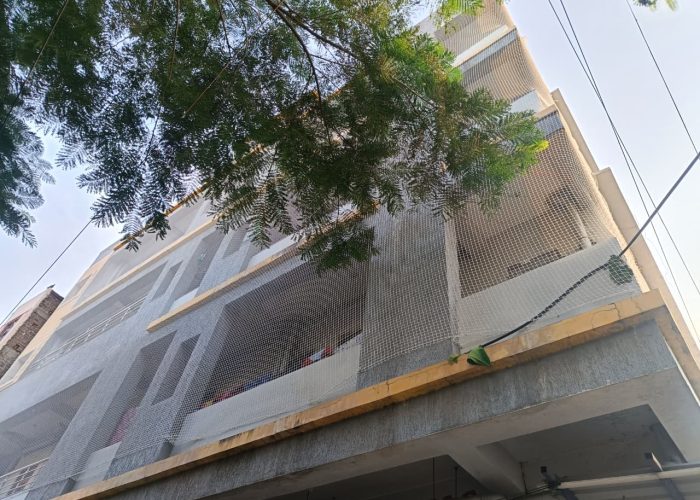 Building covered with safety nets in Hyderabad